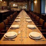Large table set for group dining in a restaurant